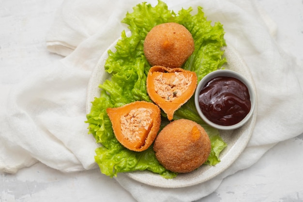 Traditional brasilian fried drumsticks Coxinha de frango on dish