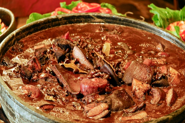 Traditional Brazilian feijoada with cabbage and rice