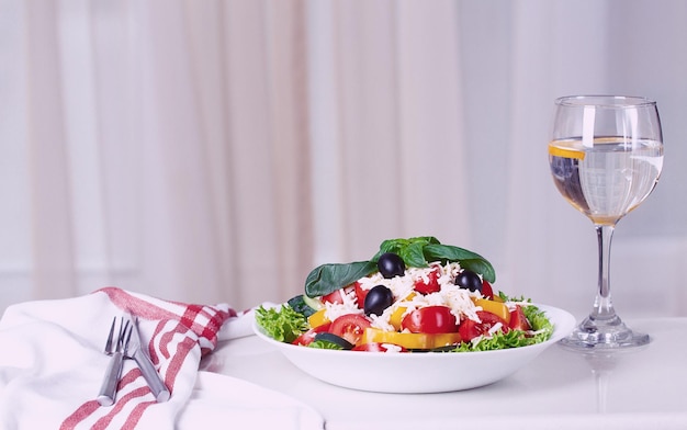 Traditional Bulgarian dish Shopsky salad with vegetables and cheese on a white background no people horizontal