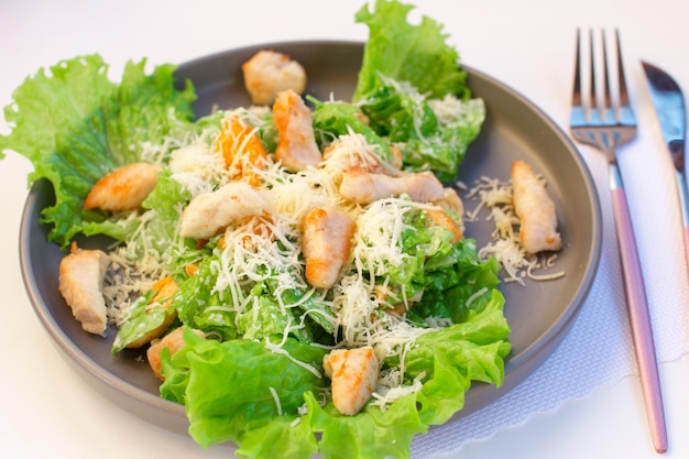 Traditional Caesar salad with Romano leaves Healthy grilled chicken salad with cheese and breadcrumbs