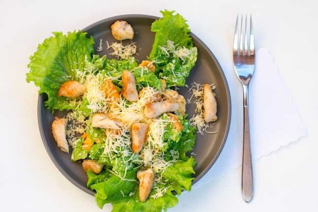 Traditional Caesar salad with Romano leaves Healthy grilled chicken salad with cheese and breadcrumbs