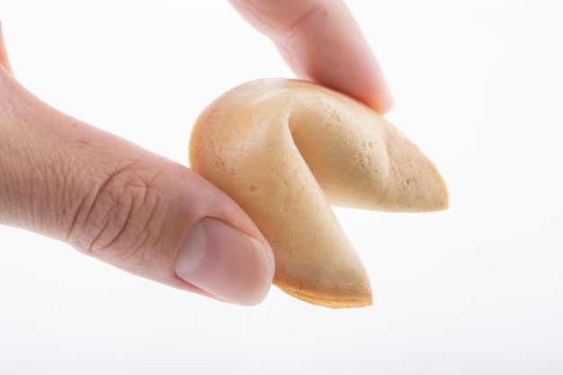 Traditional chinese fortune cookies holding hands isolated on white background