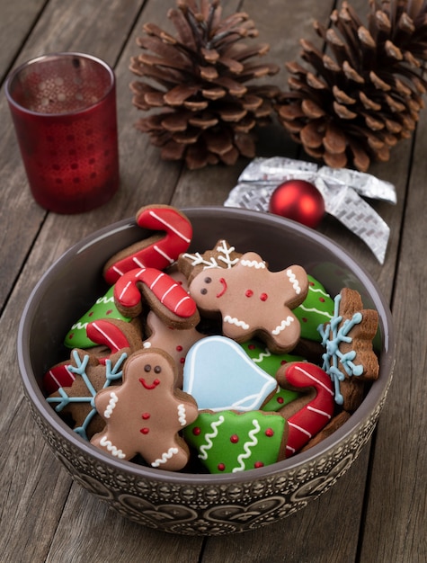 Traditional christmas gingerbread on a bowl over a wooden table.