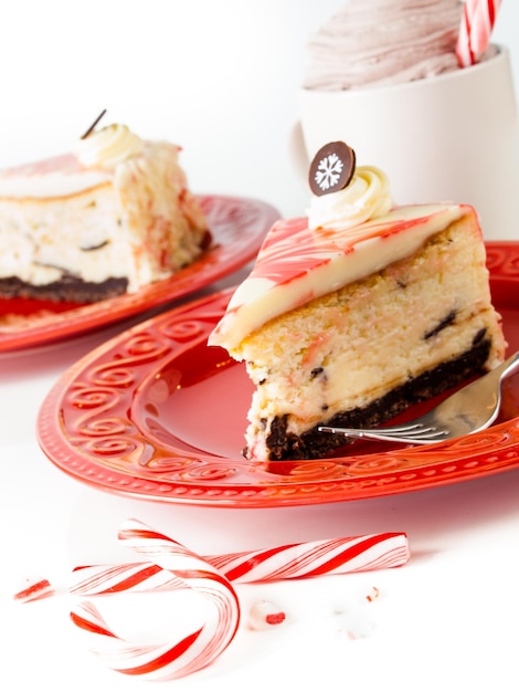 Traditional Christmas White Chocolate Peppermint Cheesecake on white background.