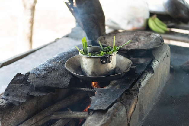 Traditional cooking with a rustic stove on the fire