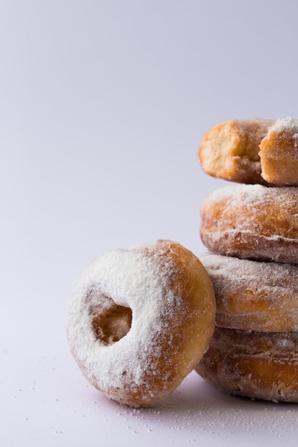 Traditional donuts on wood. Tasty doughnuts with  powdered sugar