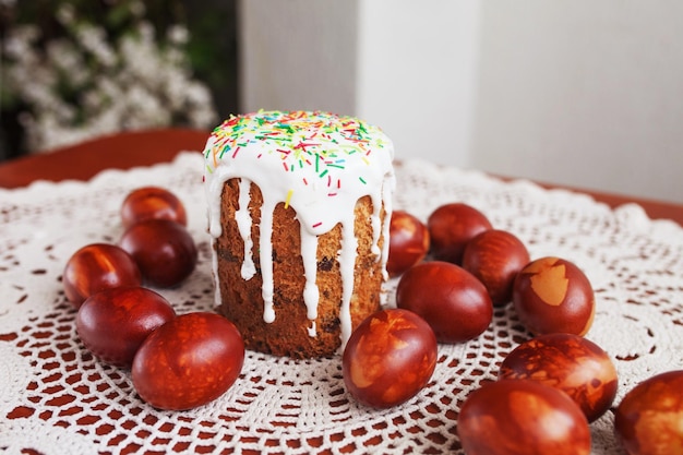 Traditional Easter cake with icing and hand painting eggs. Rustic style, religion.