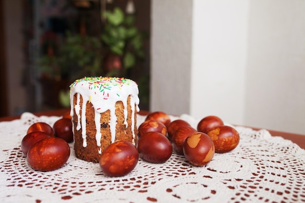 Traditional Easter cake with icing and hand painting eggs. Rustic style, religion.