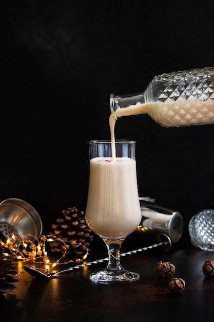 Traditional eggnog with cinnamon in a glass