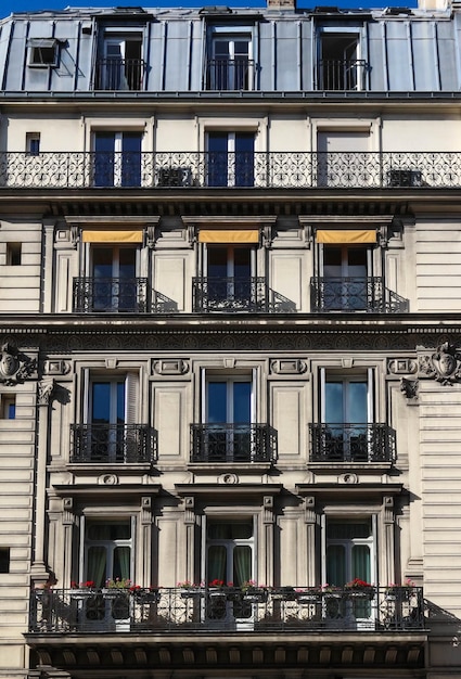 The traditional facade of Parisian building France