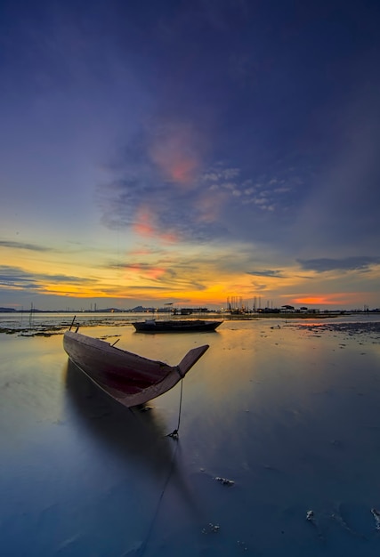 Traditional fishing boat in a fishing village at sunset on Batam island