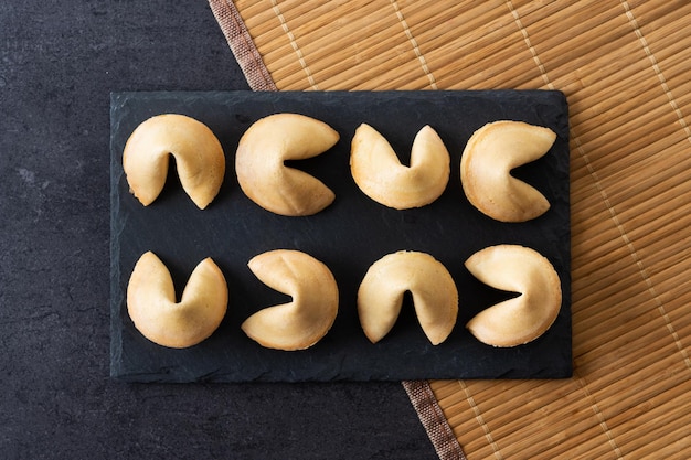 Traditional fortune cookies black slate backgroundxA