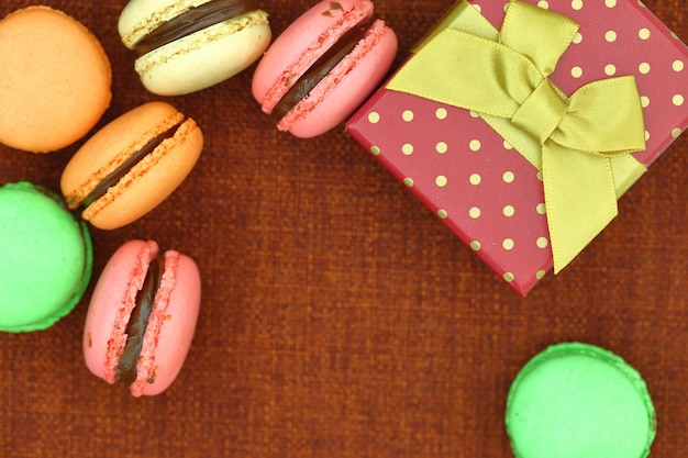 Traditional french colorful macaroons with gift box and copyspace