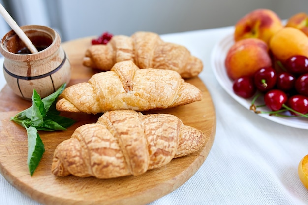 Traditional French croissant on white table background, tasty breakfast with croissants, Fresh bakery, top view