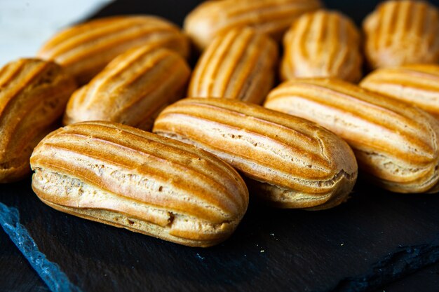 Traditional french eclairs with chocolate. Tasty dessert