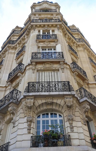 Traditional French house with typical balconies and windows Paris