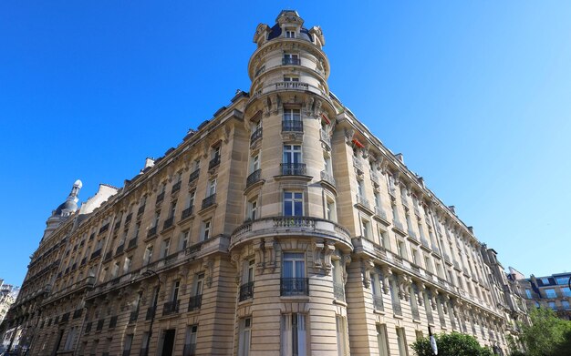 Traditional French house with typical balconies and windows Paris