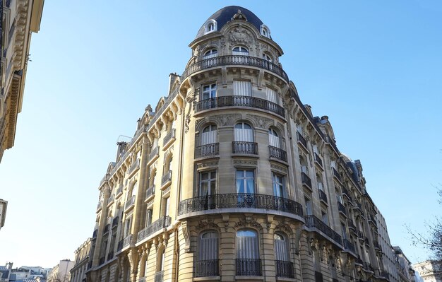 Traditional French house with typical balconies and windows Paris