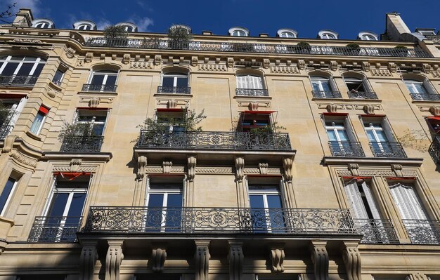 Traditional French house with typical balconies and windows Paris