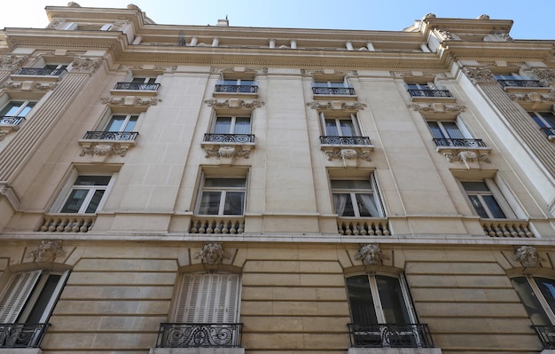 Traditional French house with typical balconies and windows Paris