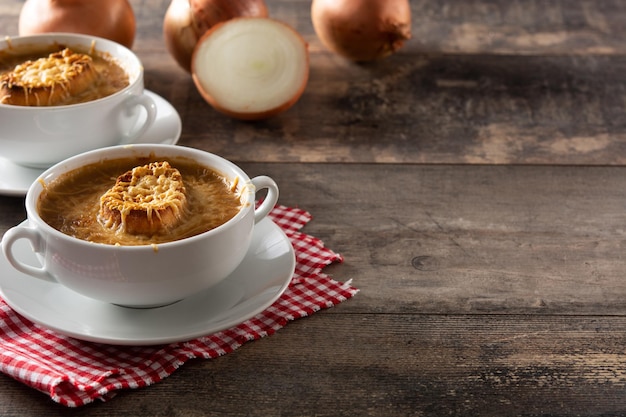 Traditional french onion soup on wooden table