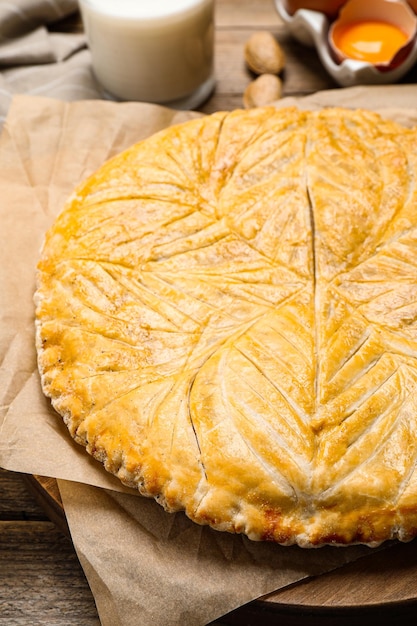 Traditional galette des rois on wooden table closeup