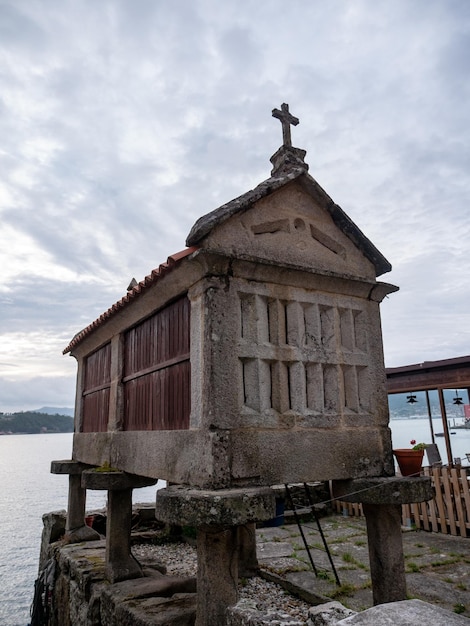 Traditional granaries or horreos by the sea in the village of Combarro Spain