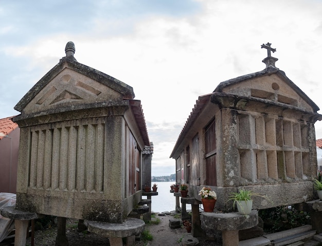 Traditional granaries or horreos by the sea in the village of Combarro Spain