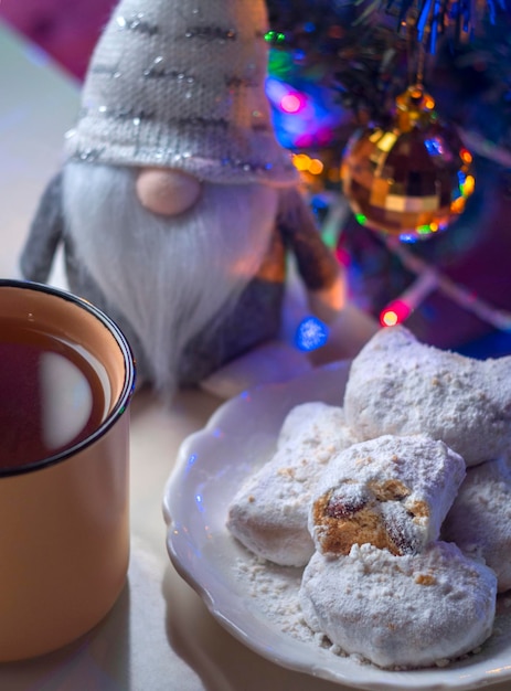 Traditional Greek Christmas cookies Kurabye with almonds and powdered sugar and Christmas Gnome