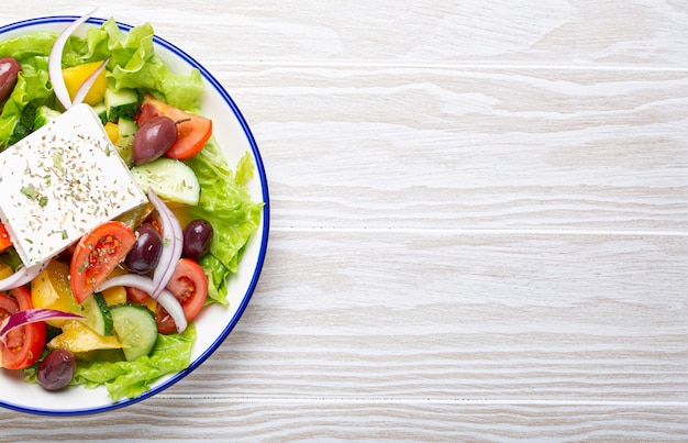 Traditional greek salad with feta cheese tomatoes bell