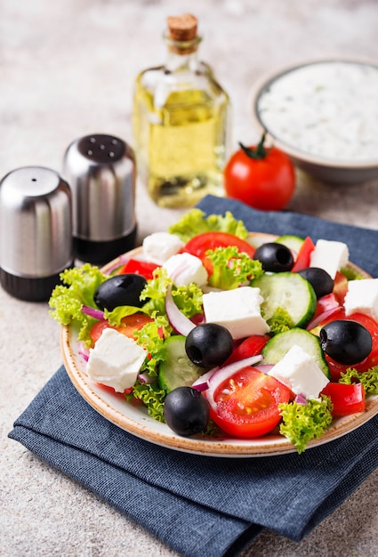 Traditional Greek salad with feta, olives and vegetables