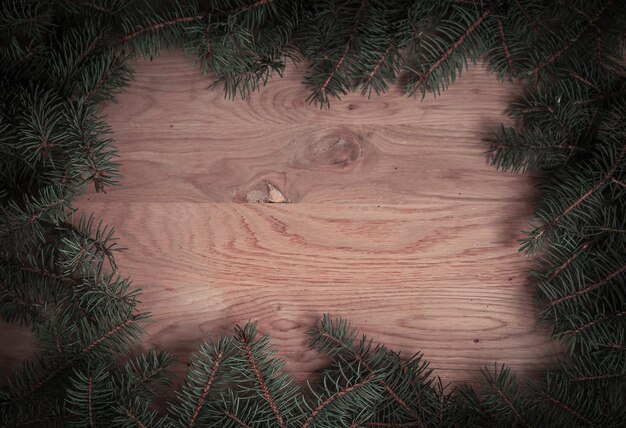 Traditional green Christmas wreath on wooden background