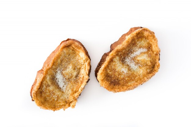 Traditional homemade Spanish torrijas isolated on white surface Easter dessert.