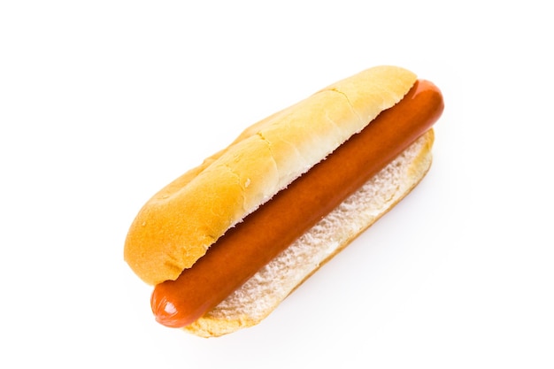 Traditional hot dogs on a white hot dog bun on a white background.