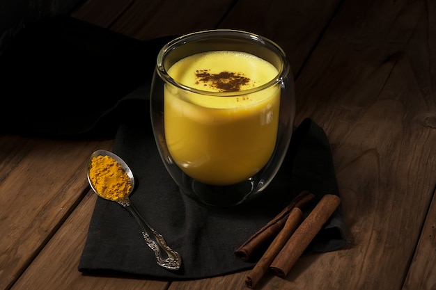 Traditional Indian drink. Golden latte, turmeric milk with spice