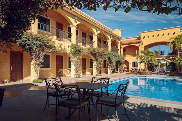 Traditional inner yard of a mexican mansion with a turquoise swimming pool