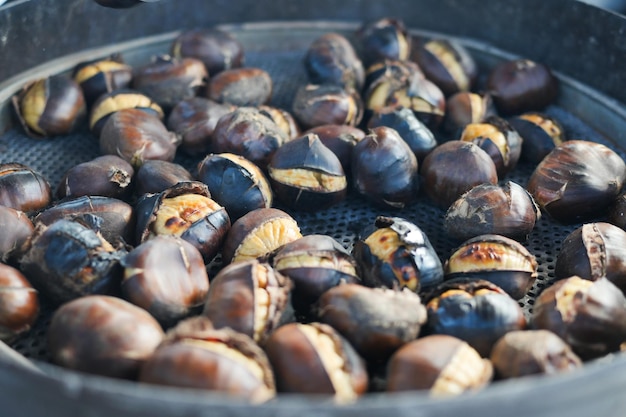 Traditional istanbul street food grilled chestnuts in a row