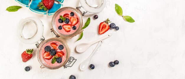 Traditional Italian dessert panna cotta with strawberry jelly Summer yogurt dessert Long banner format space for text