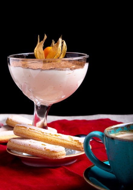 Traditional Italian dessert tiramisu in glass