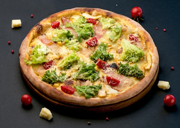 Traditional Italian pizza vegetables ingredients on a dark background Pizza is cooked in the oven