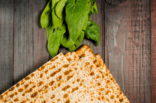 Traditional Jewish kosher matzo for Easter pesah on a wooden table