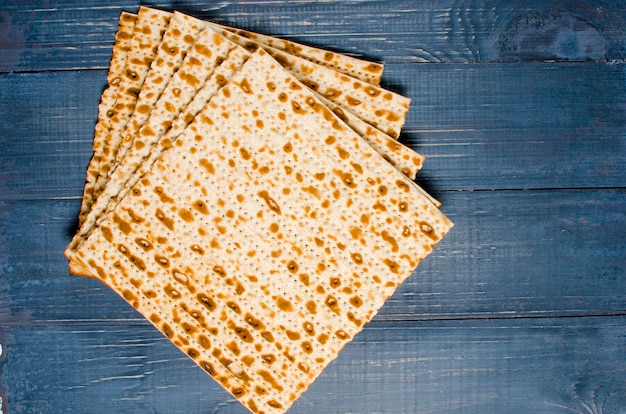 Traditional Jewish kosher matzo for Easter pesah on a wooden table