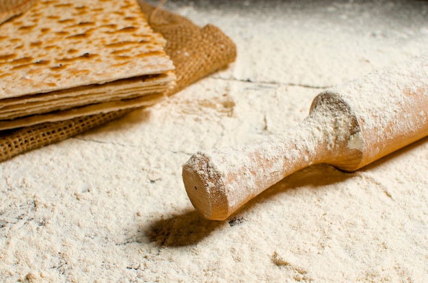 Traditional Jewish kosher matzo for Easter pesah on a wooden table