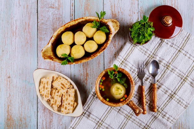 Traditional Jewish matzah ball soup, matzo and matzo balls