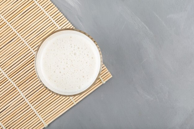 Traditional korean beverage Misutgaru Latte on grey background, top view.