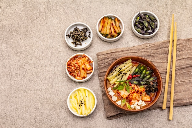 Traditional Korean spicy soup with kimchi, tofu, vegetables. Hot dish for healthy meal