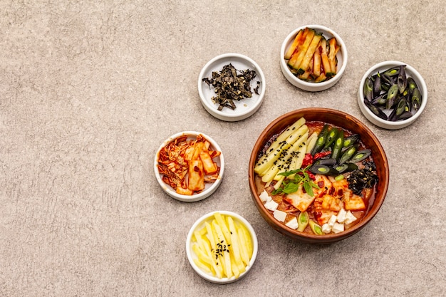 Traditional Korean spicy soup with kimchi, tofu, vegetables. Hot dish for healthy meal