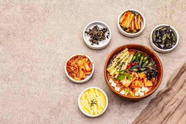 Traditional Korean spicy soup with kimchi, tofu, vegetables. Hot dish for healthy meal