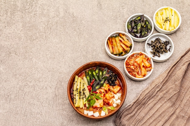 Traditional Korean spicy soup with kimchi, tofu, vegetables. Hot dish for healthy meal