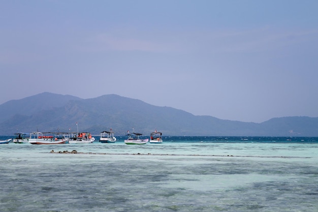 traditional Longtale boats at the beautiful beach Karimun Jawa Island Indonesia